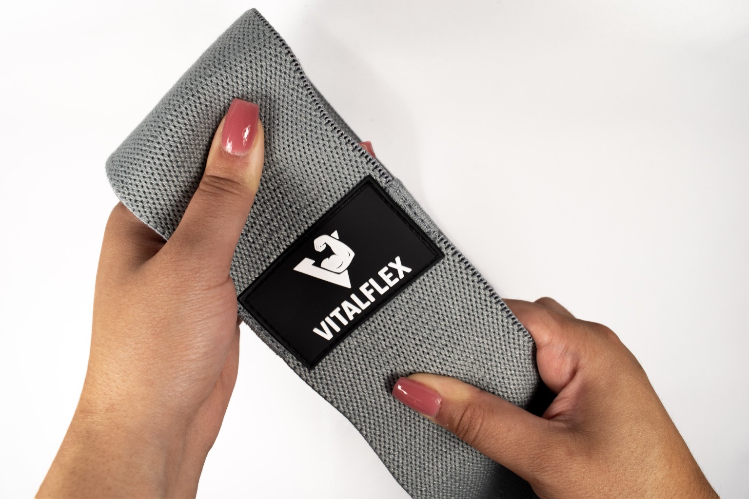 Close-up of VITALFLEX logo on black band